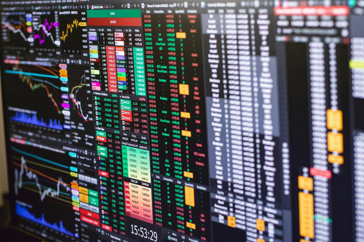 A digital token emerging — the blockchain layer that makes fractional ownership native